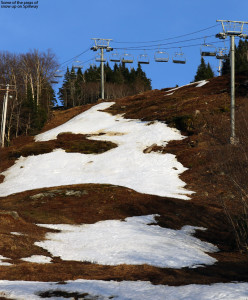 An image showing the remaining snow on the Spillway trail at Bolton Valley Ski Resort in Vermont in early May