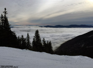 An image showing low clouds with mountains sticking out as viewed from Mt. Mansfield and Stowe Ski Resort in Vermont