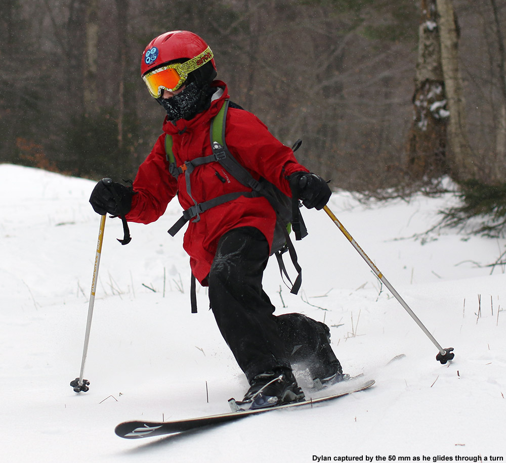 An image of Dylan Telemark skiing on fresh snow at Bolton Valley Ski Resort in Vermont