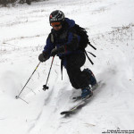 An image of Jay Telemark skiing on some fresh powder from Winter Storm Goliath at Bolton Valley Ski Resort in Vermont