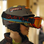 An image of a boy wearing multiple pairs of ski goggles for fun
