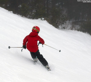 An image of Dylan carving a turn on the Liftline trail at Stowe Mountain Resort in Vermont