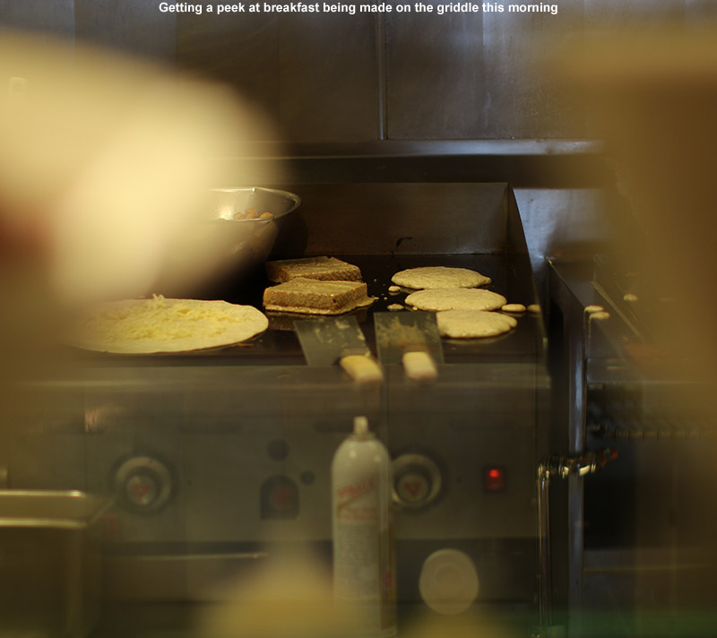 An image of breakfast cooking on a griddle at the Great Room Grill at Stowe Mountain Resort in Vermont