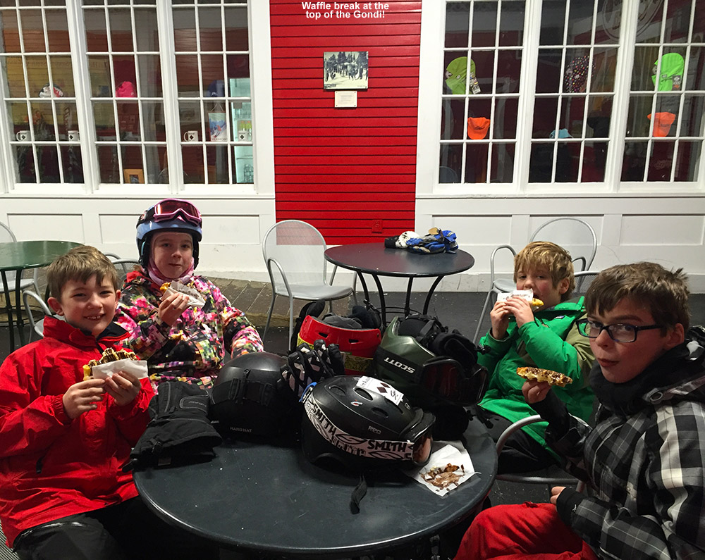 An image of some BJAMS students having chocolate-covered waffles up at the top of the Gondola at Stowe Mountain Resort in Vermont