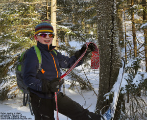 An image of Dylan removing his skins from his skis on a backcountry ski outing on the backcountry network at Bolton Valley Ski Resort in Vermont