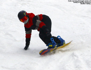 An image of Cole riding his snowboard in soft spring snow at Bolton Valley Ski Resort in Vermont