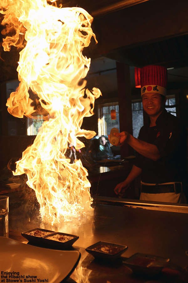 An image showing a huge flame on the hibachi grill at Sushi Yoshi restaurant in Stowe, Vermont