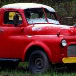 An image showing an antique truck with some May snow on it in Waterbury Center, Vermont