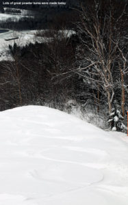 An image of ski tracks in powder from a mid May snowstorm on the slopes of Mt Mansfield at Stowe Mountain Resort in Vermont