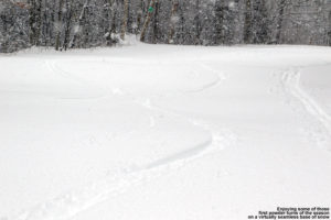 An image of ski tracks in powder snow on the Lower Turnpike trail at Bolton Valley Resort in Vermont