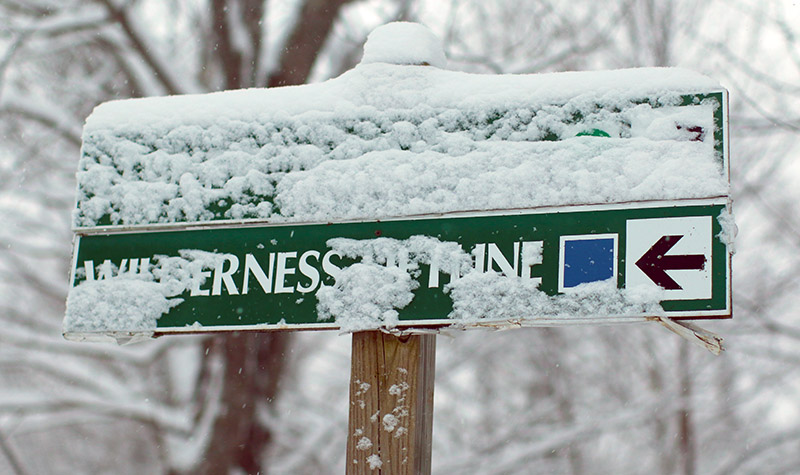 An image of trails signs with snow at Bolton Valley Ski Resort in Vermont
