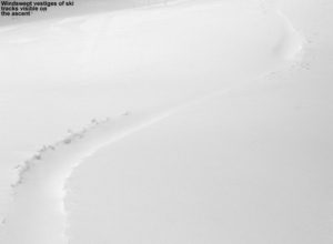 An image of a ski track in powder snow partially filled in by the wind at Bolton Valley Ski Resort in Vermont