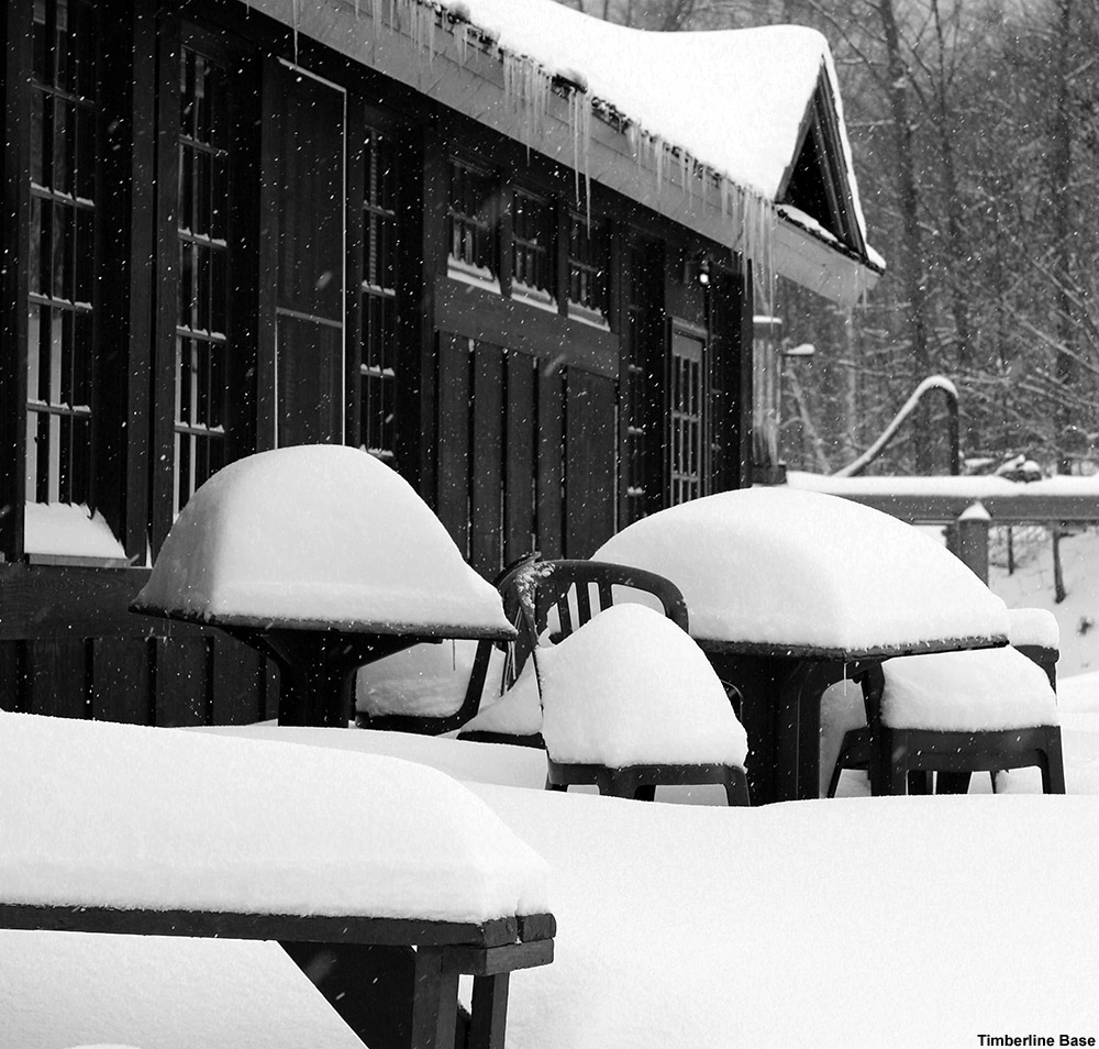 An image of snow accumulations outside the Timberline Base Lodge at Bolton Valley Ski Resort in Vermont