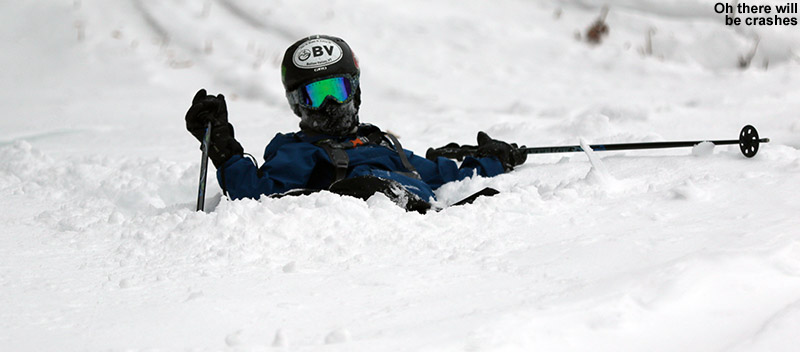 An imae of Ty in powder snow after a fall skiing at Bolton Valley Ski Resort in Vermont