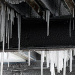 An image of icicles below the deck of the Cliff House at Stowe Mountain Resort in Vermont