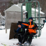 An image of Ty and Dylan on a chairlift at Bolton Valley Ski Resort in Vermont