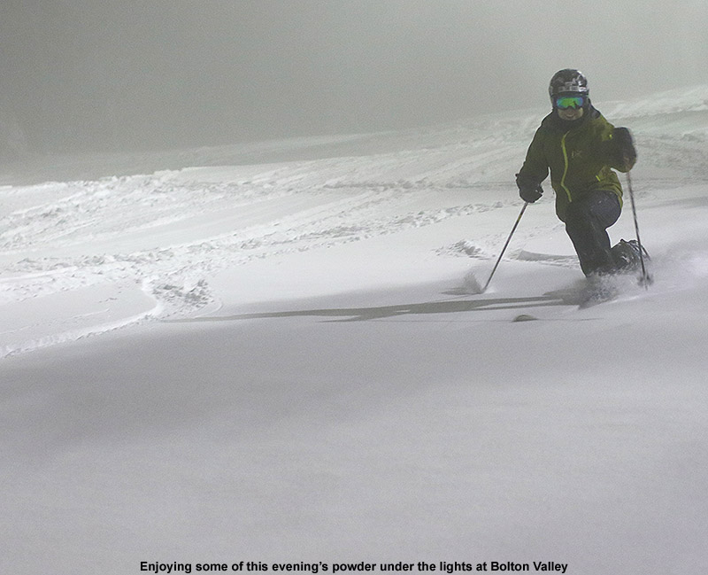 An image of Jay skiing powder at night under the lights at Bolton Valley Resort in Vermont