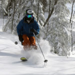 An image of Ty skiing powder in the Wilderness Woods at Bolton Valley Resort in Vermont