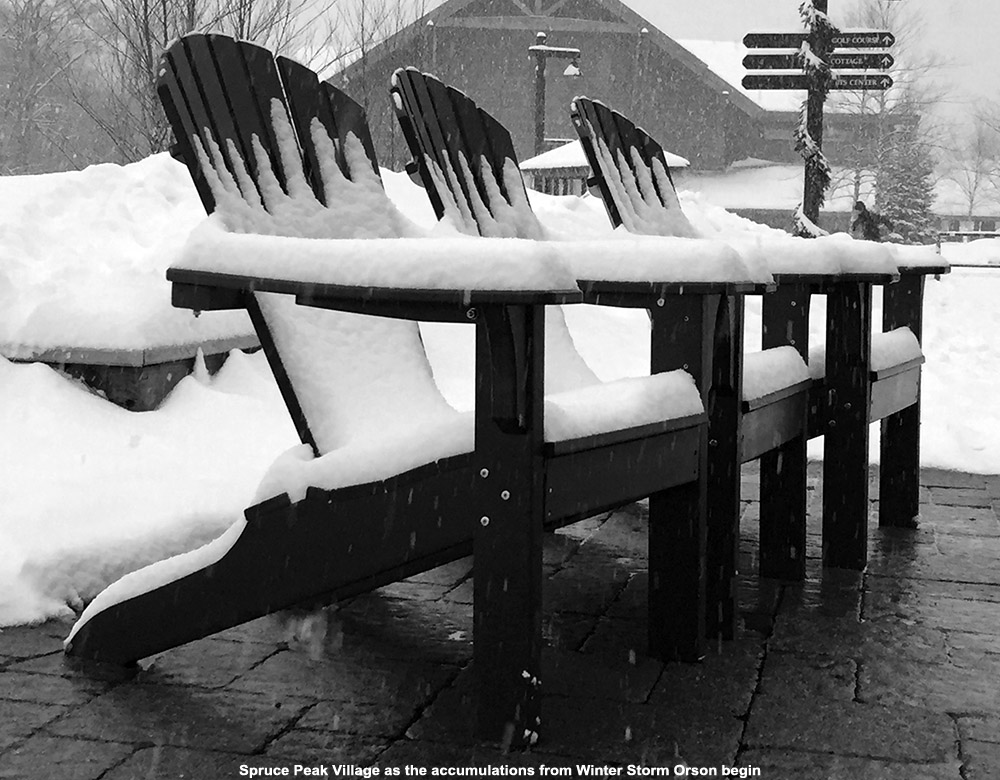 An image of deck chairs with a bit of snow accumulation from Winter Storm Orson at Stowe Mountain Ski Resort in Vermont