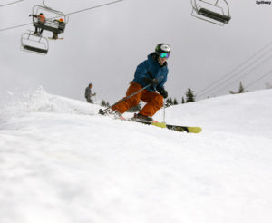 An image of Ty skiing in spring snow on the Spillway trail at Bolton Valley Ski Resort in Vermont