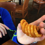 An image of a curly french fry from the Great Room Grill at Stowe Mountain Resort in Vermont