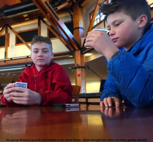 An image of some BJAMS students playing cards in the Great Room at Stowe Mountain Resort in Vermont