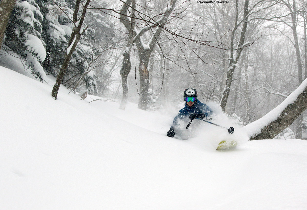 An image of Ty skiing deep powder in the Ravine/Whitewater area at Stowe Mountain Resort in Vermont during Winter Storm Stella