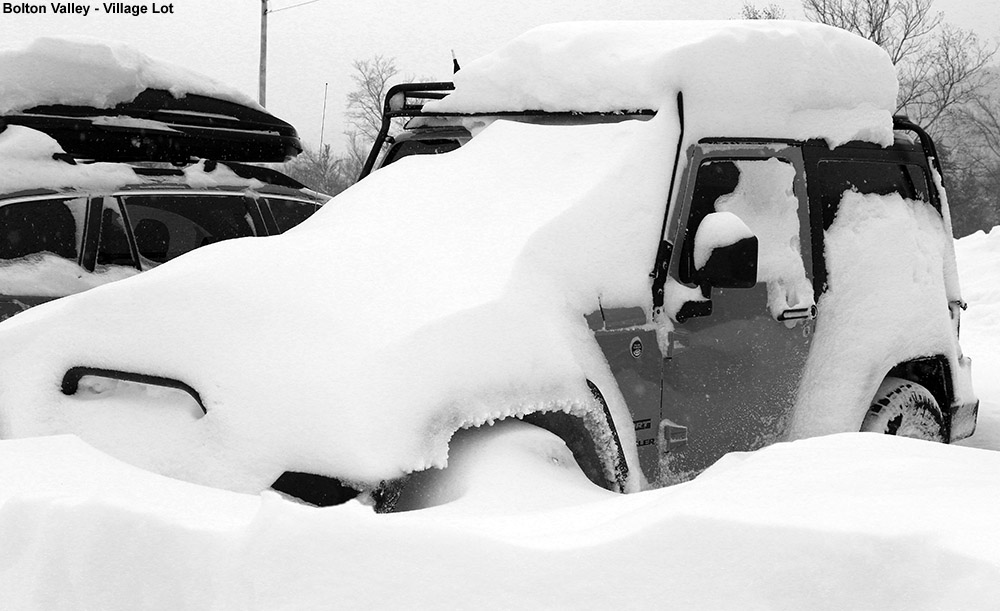 An image of a car with drifted snow at Bolton Valley Ski Resort in Vermont