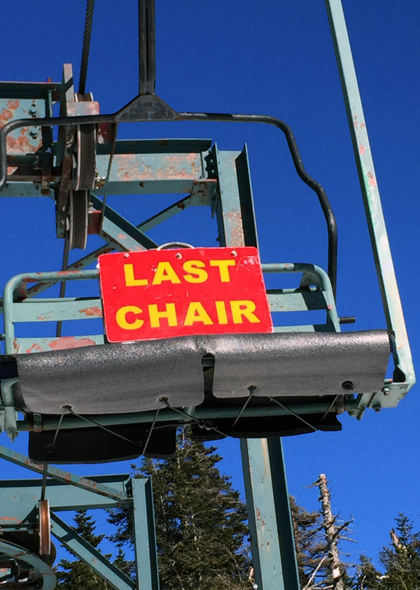 An image of the last chair sign on the Wilderness Double Chairlift at Bolton Valley Ski Resort in Vermont
