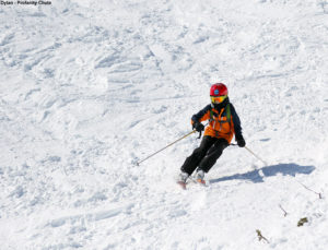 An image of Dylan skiing Profanity Chute above Stowe Mountain Resort in Vermont