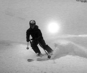 An image of Ty night skiing in a snowstorm at Bolton Valley Resort in Vermont