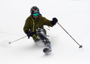 An image of Jay Telemark skiing in powder snow at Bolton Valley Resort in Vermont