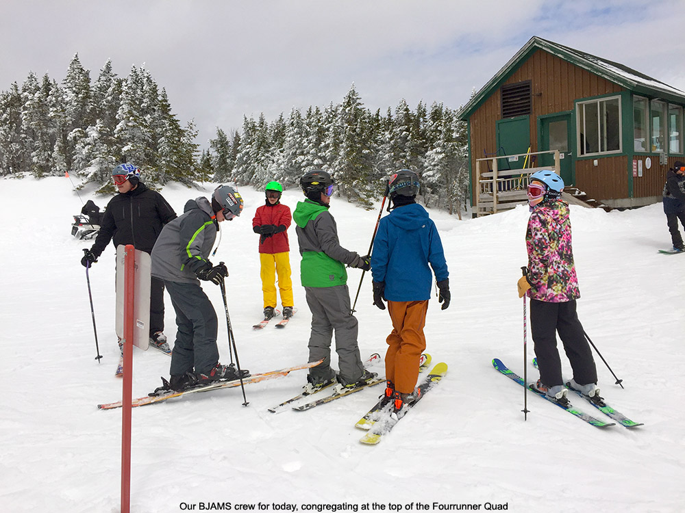 An image of BJAMS students at the top of the Fourrunner Quad at Stowe Mountain Resort in Vermont