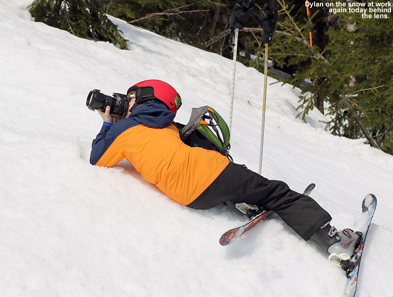 An image of Dylan on the snow doing some ski photography at Stowe Mountain Resort in Vermont