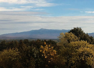 An image of Mt. Mansfield in Vermont with a bit of October snow atop the Chin