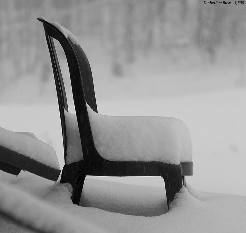 An image of snow from Winter Storm Dylan collecting on a chair by the Timberline Base Lodge at Bolton Valley Ski Resort in Vermont