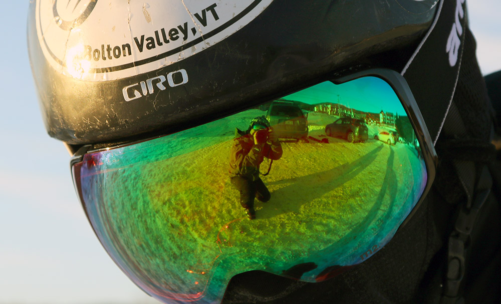 An image of Ty's Anon M2 ski goggles with the photographer Jay in the reflection at Bolton Valley Ski Resort in Vermont