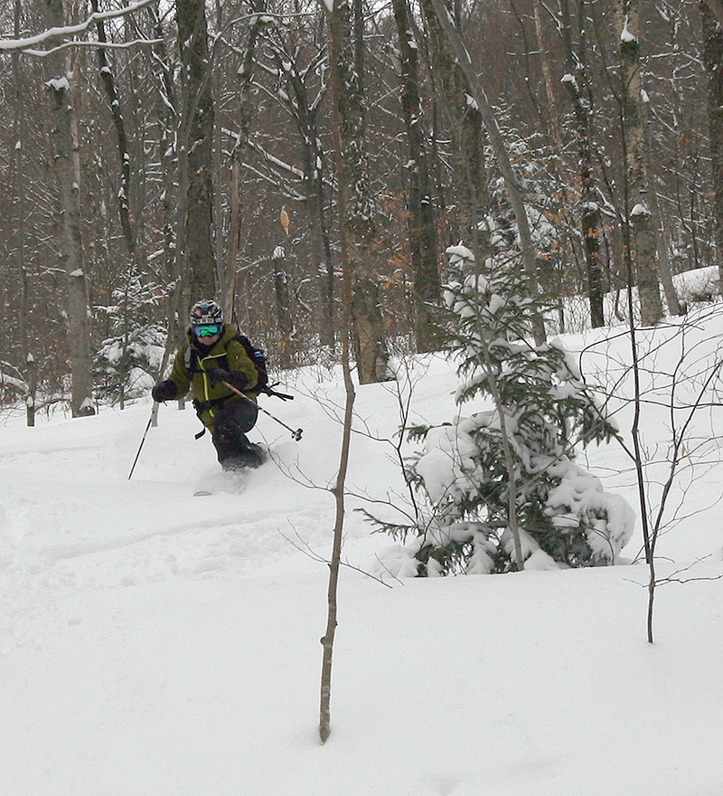 An image of Jay skiing powder in the backcountry near Bolton Valley Ski Resort in Vermont