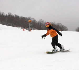 An image of Dylan snowboard in the Meadows are at Stowe Mountain Resort in Vermont