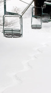An image of a snowboard track in powder snow at Bolton Valley Ski Resort in Vermont after Winter Storm Quinn