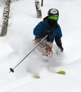 An image of Ty skiing powder in the Villager Trees area of Bolton Valley Resort in Vermont