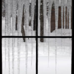 An image out the window of the Bryant Cabin showing icicles in the backcountry near Bolton Valley Ski Resort in Vermont