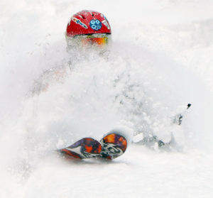 An image of Dylan skiing deep powder after Winter Storm Skylar at Stowe Mountain Resort in Vermont