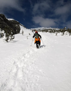 An image of Dylan ascending the Climbing Gully in Mt. Mansfield's alpine terrain above Stowe Mountain Resort in Vermont
