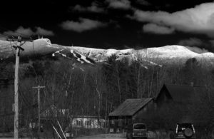 An image of Mt. Mansfield in Vermont with fresh snow on a sunny day in April