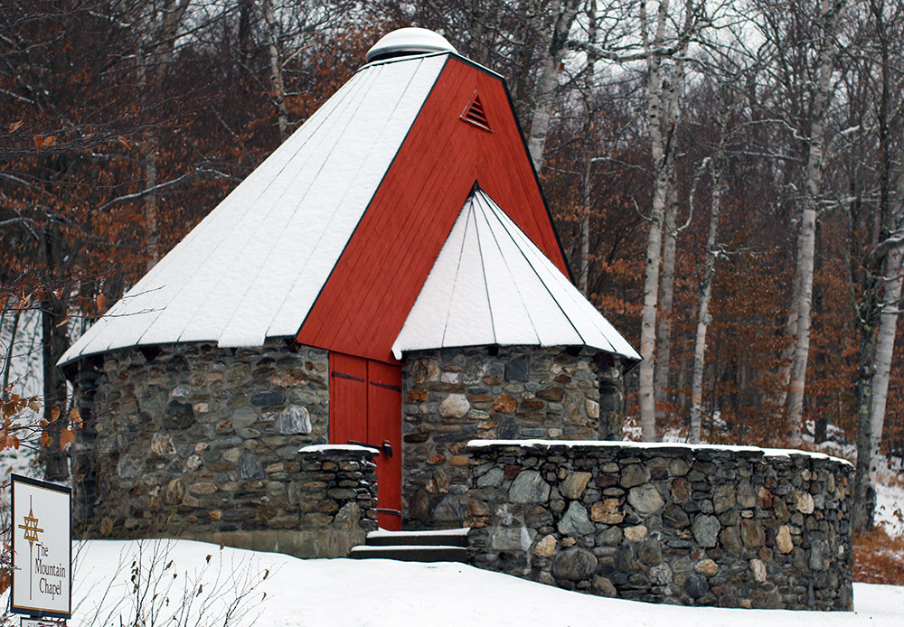 An image of the Mountain Chapel in an October snowstorm at Stowe Mountain Resort in Vermont