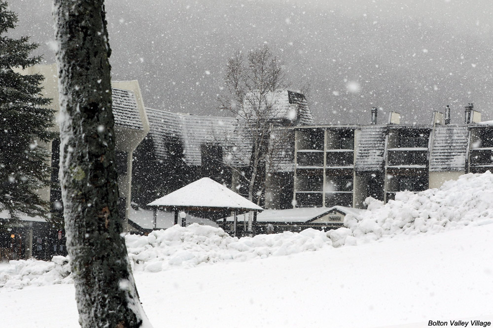 An image of November snow in the Bolton Valley Village at Bolton Valley Ski Resort in Vermont