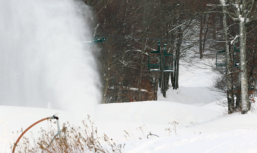 An image of a snow gun making snow in mid November at Bolton Valley Ski Resort in Vermont