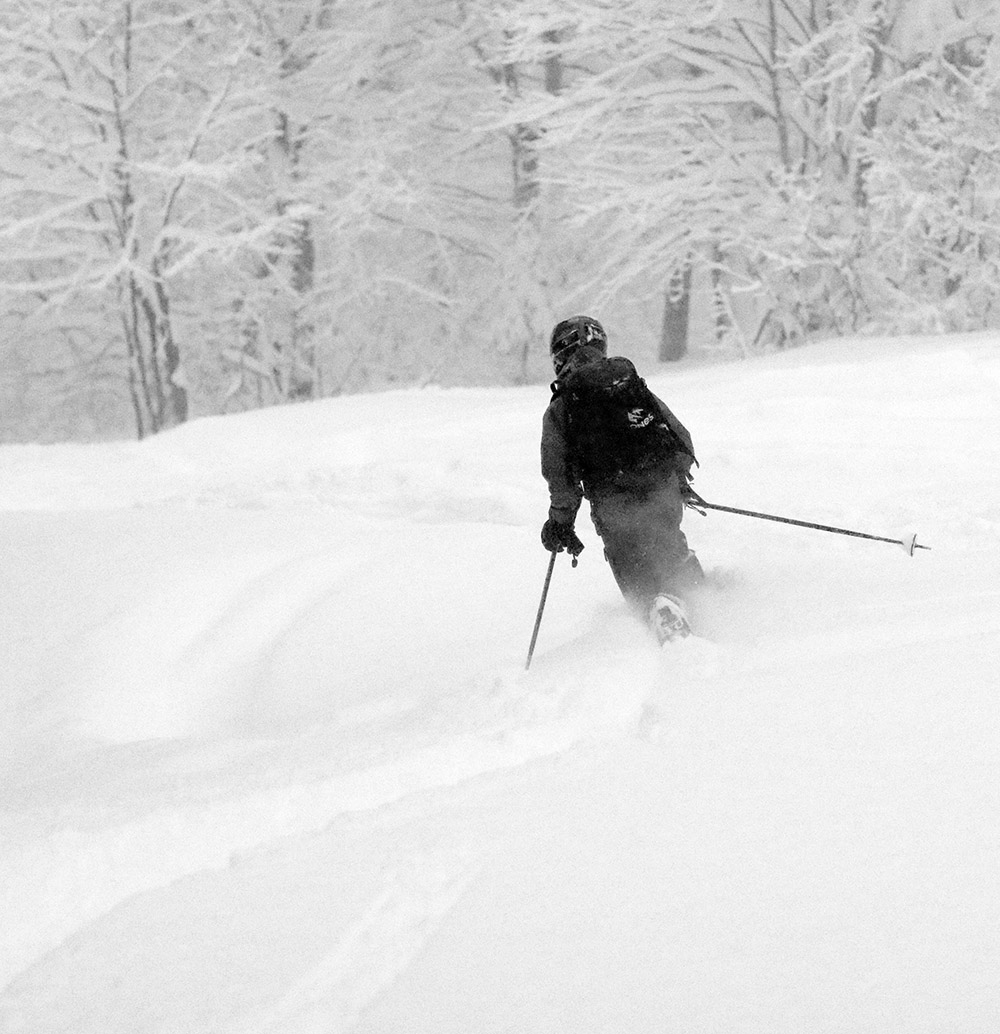 An image of Ty Telemark skiing in 18 to 20 inches of fresh powder from Winter Storm Bruce at Bolton Valley Resort in Vermont