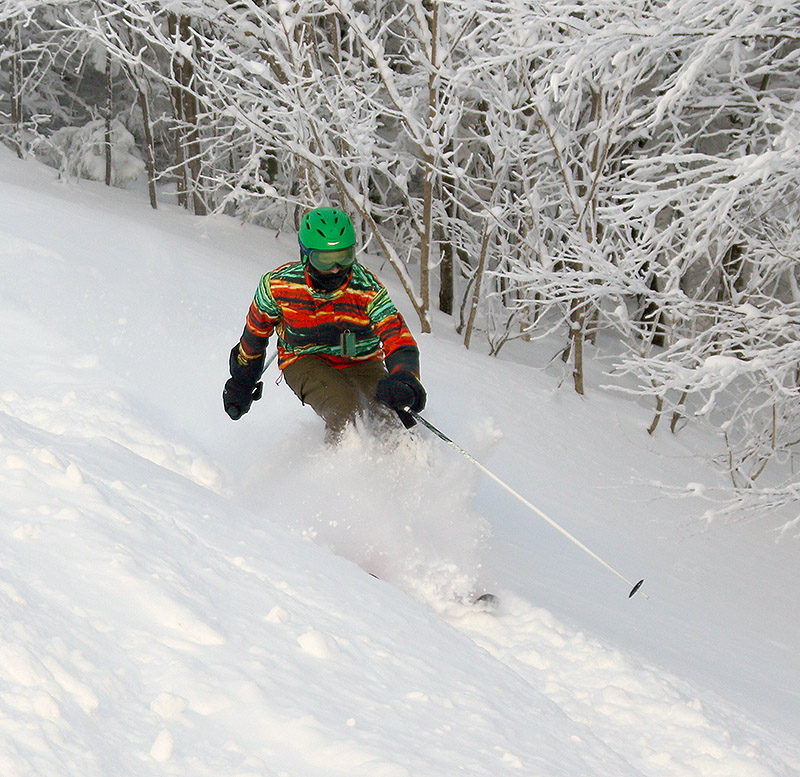 An image of Johannes skiing powder in the Wilderness area at Bolton Valley Resort in Vermont